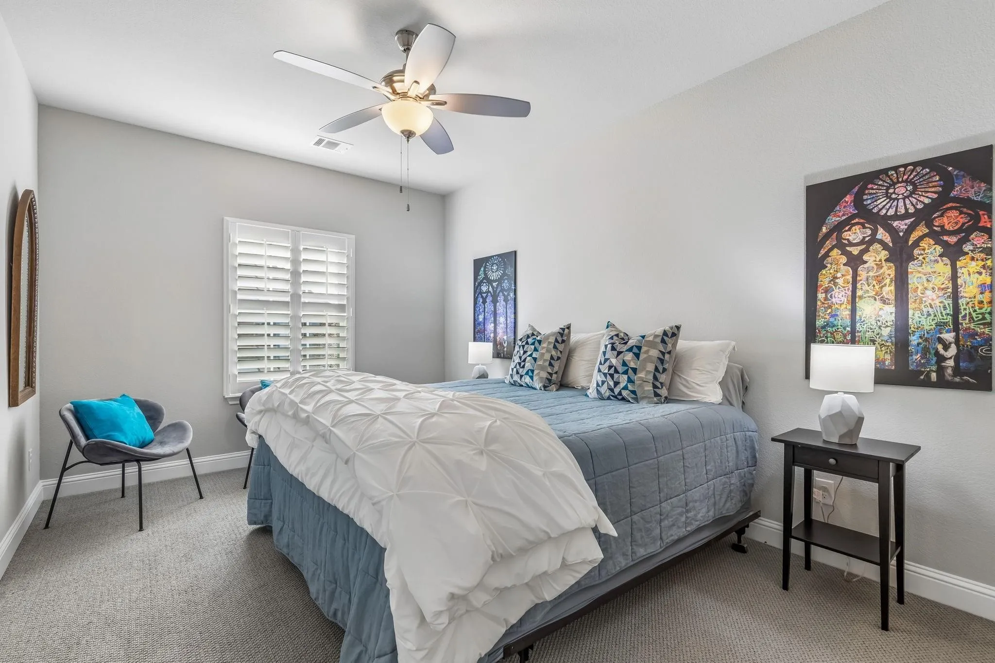 Spacious secondary bedroom with a private ensuite bath, providing a comfortable retreat for family and guests.