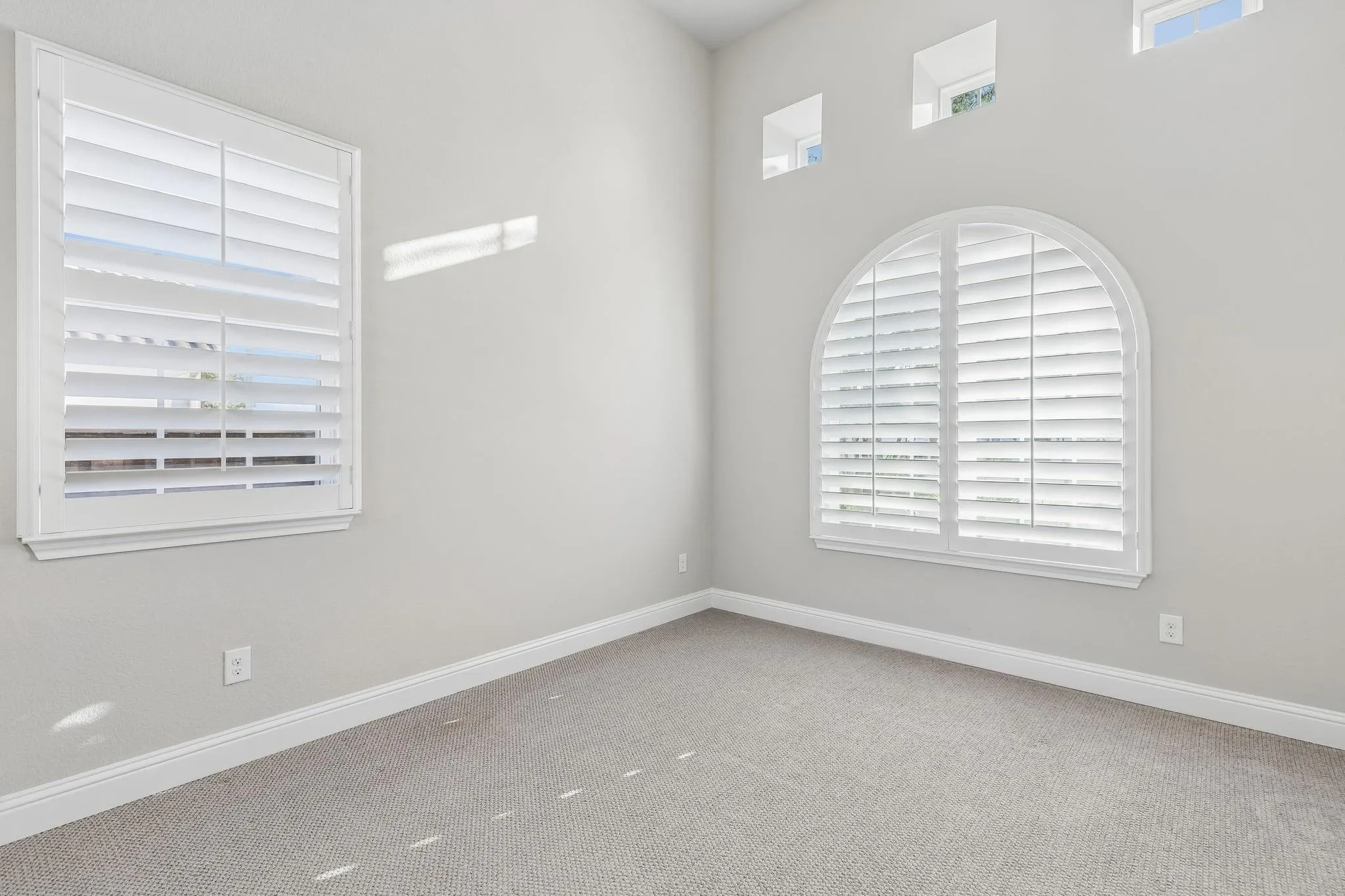 Private downstairs secondary bedroom with an ensuite bath—ideal for guests or multigenerational living.