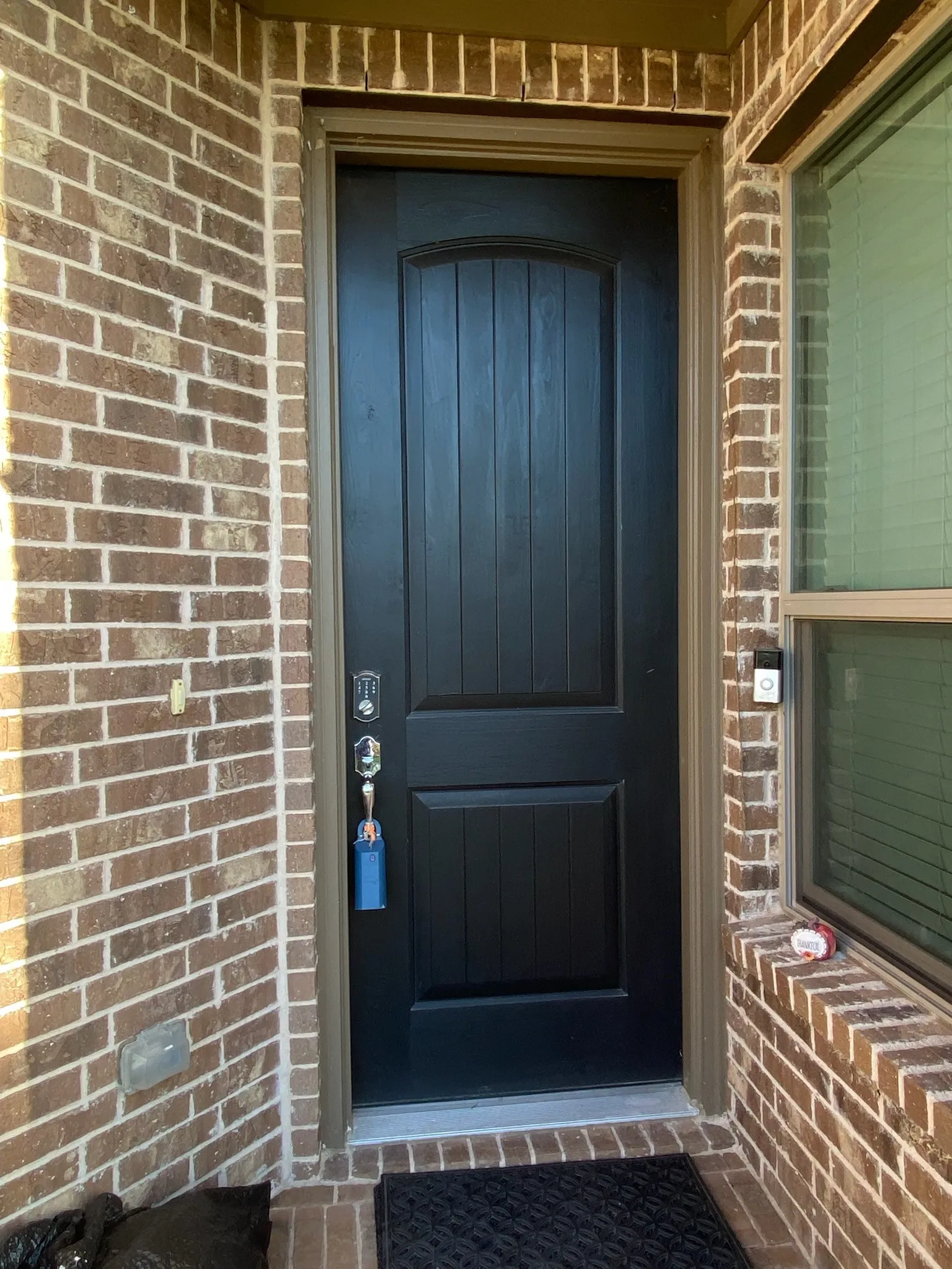 Property entrance with brick siding