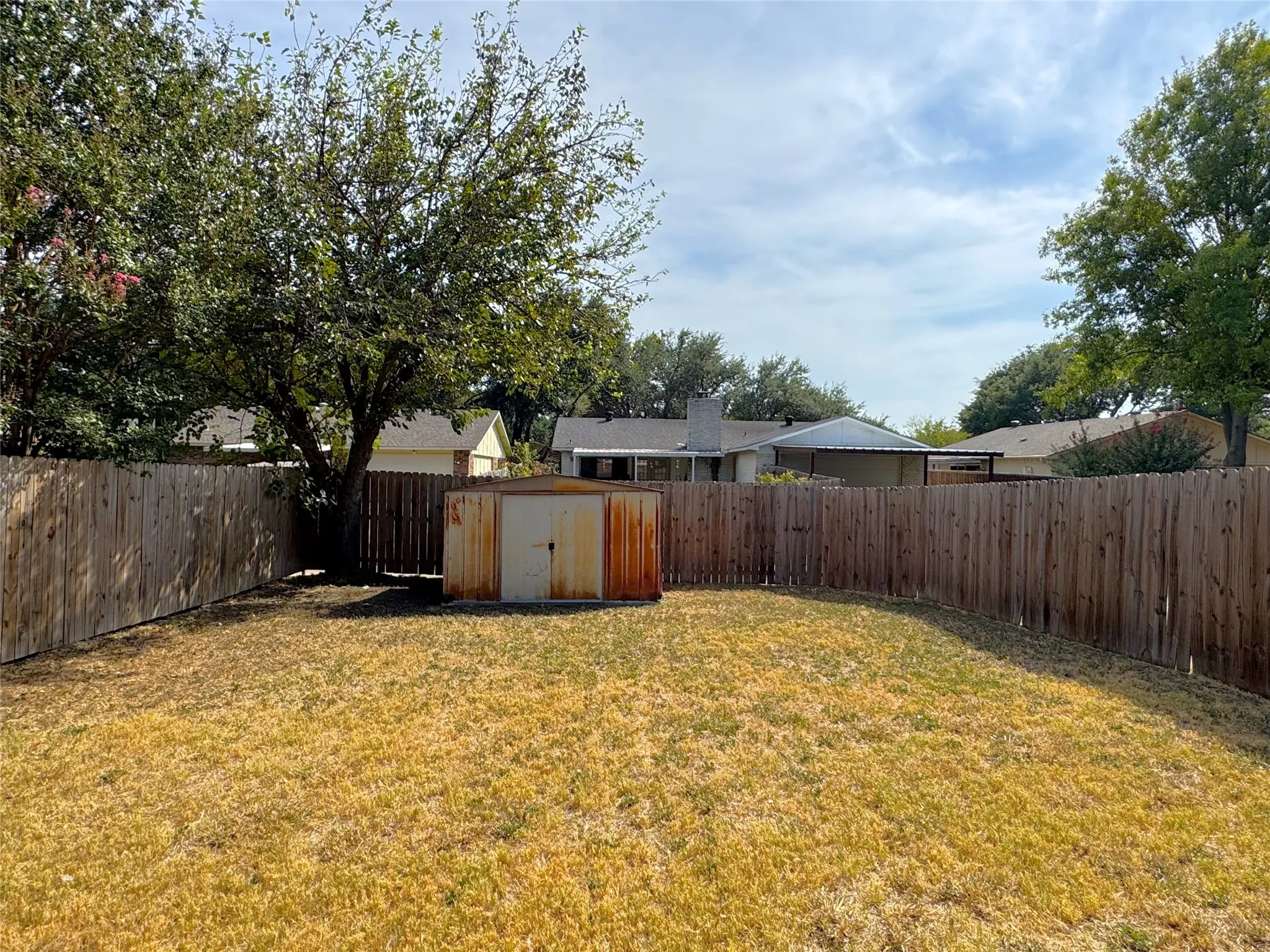 Private backyard with a storage shed