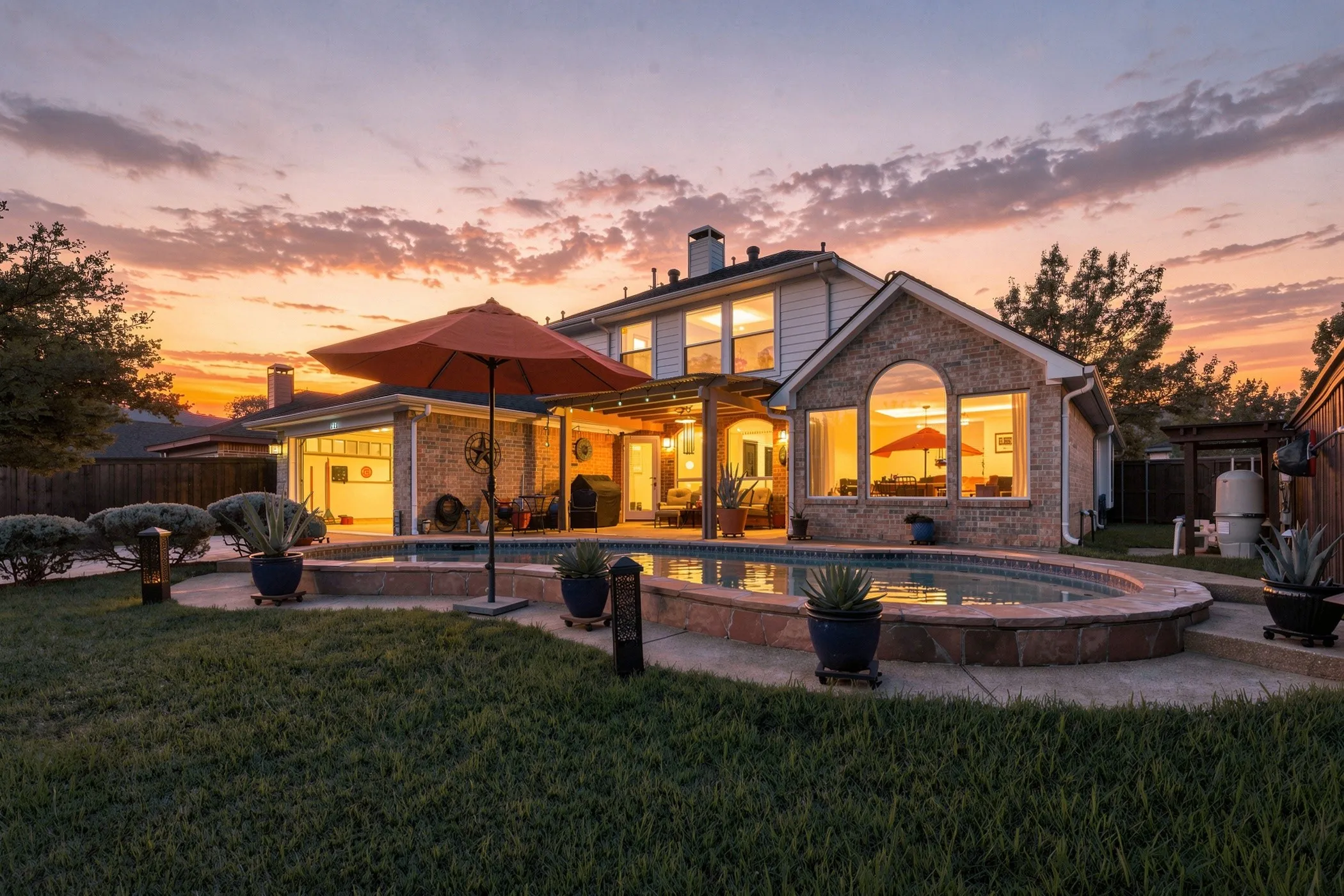 Twilight view of backyard and back of house.
