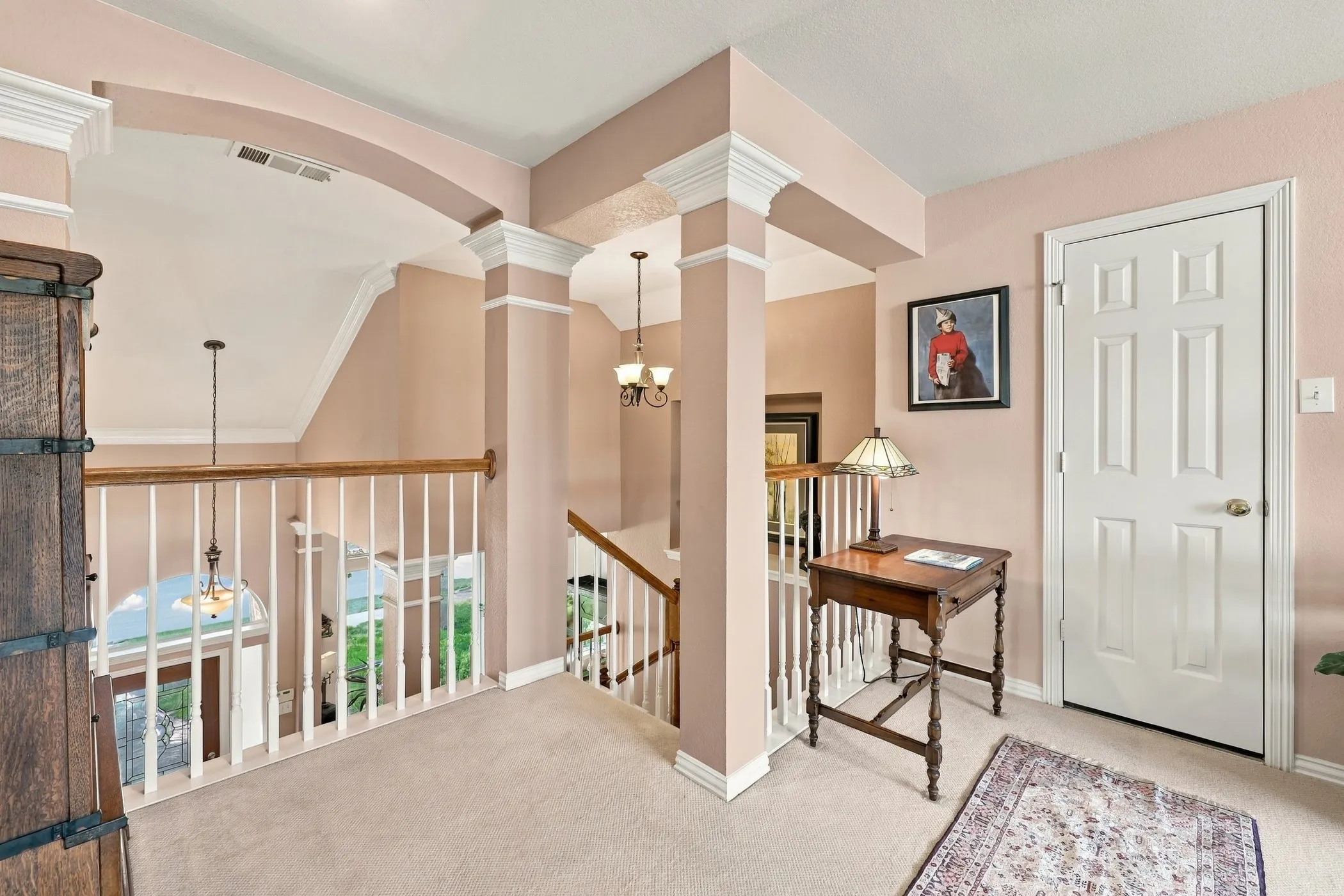 Upstairs loft gameroom with walk-in attic door.  Insulated barrier insulation in both attics.