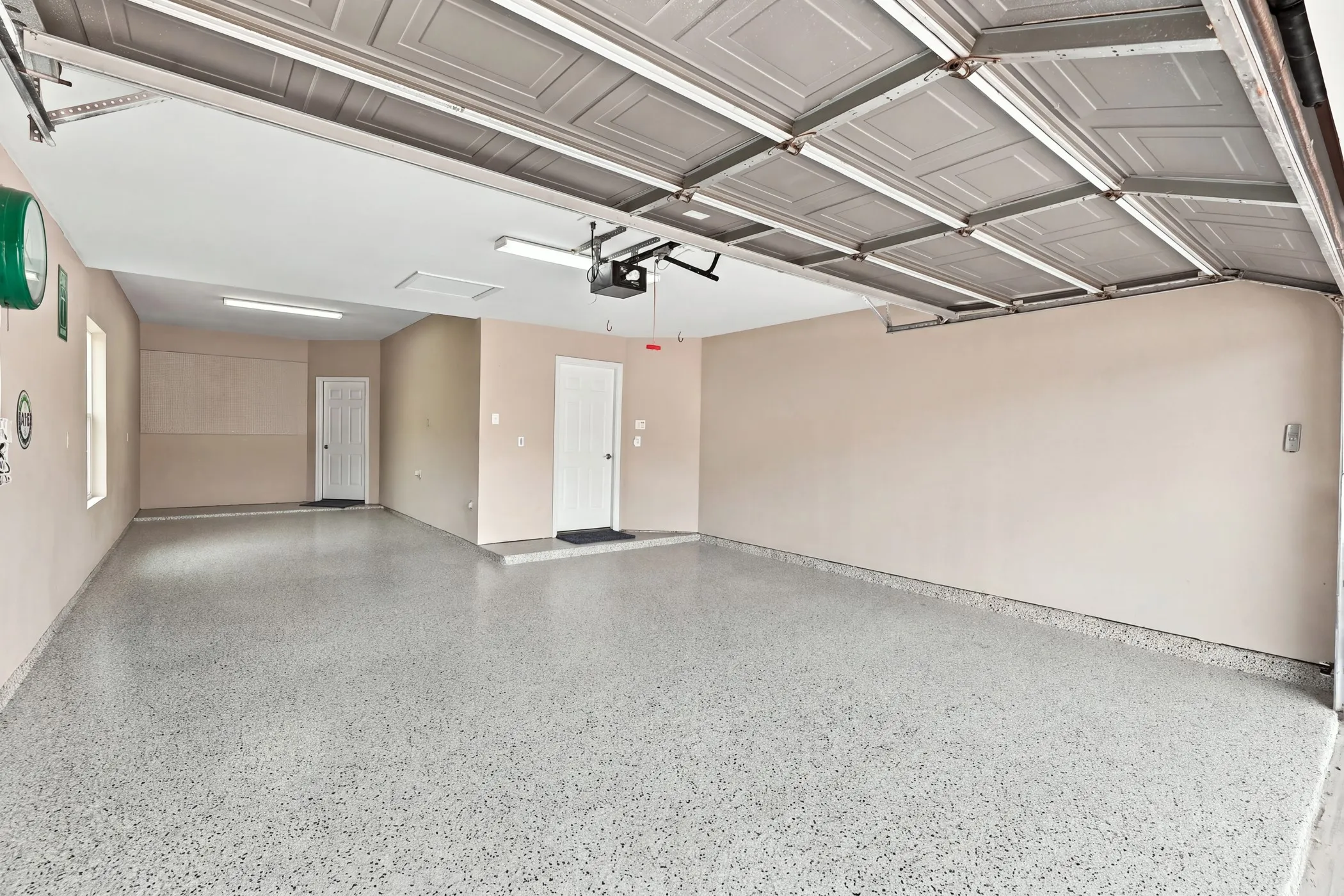 3-car tandem garage with recent epoxy-finished floor (August, 2026).