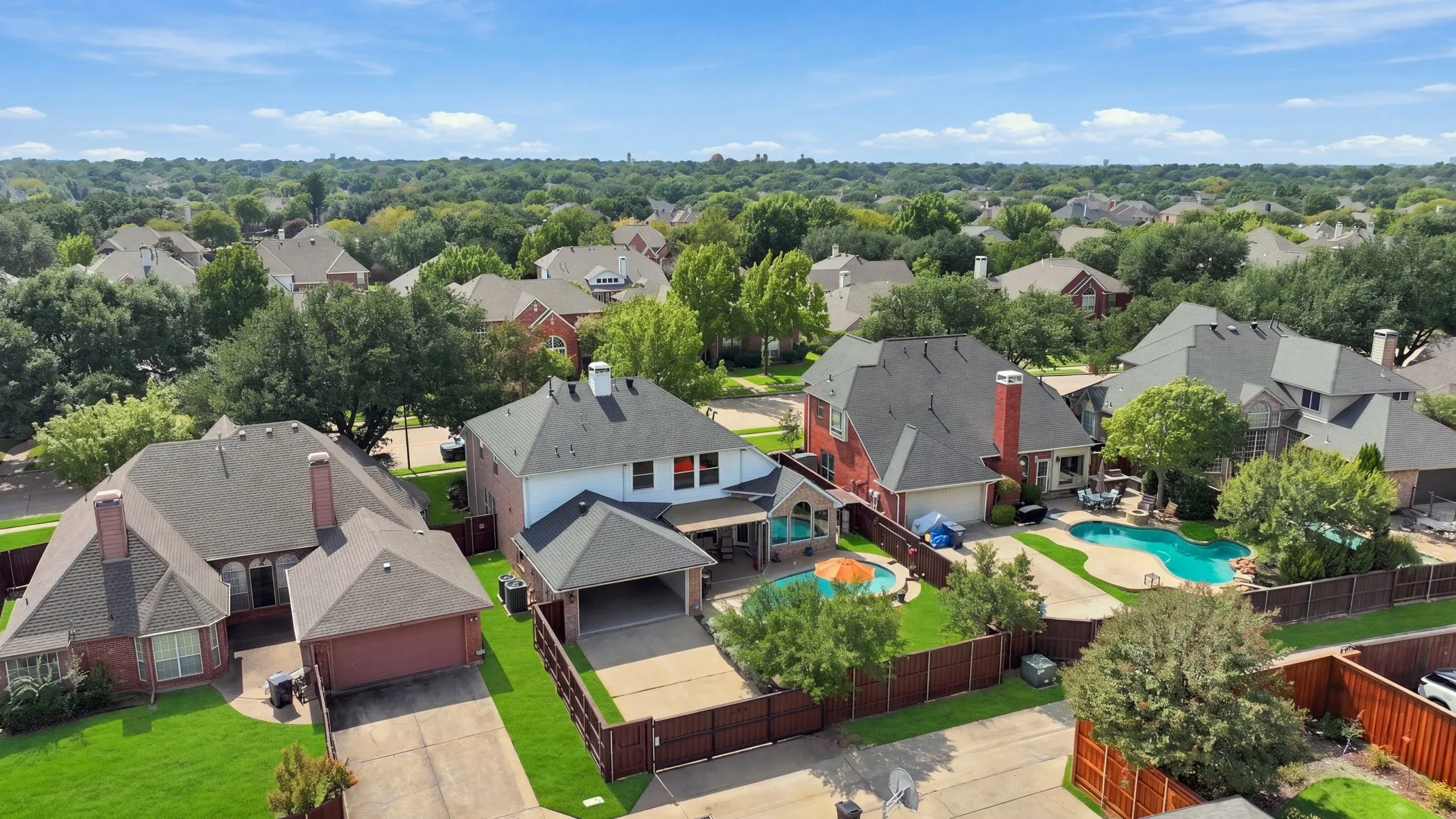 Enclosed backyard with electric driveway gate.