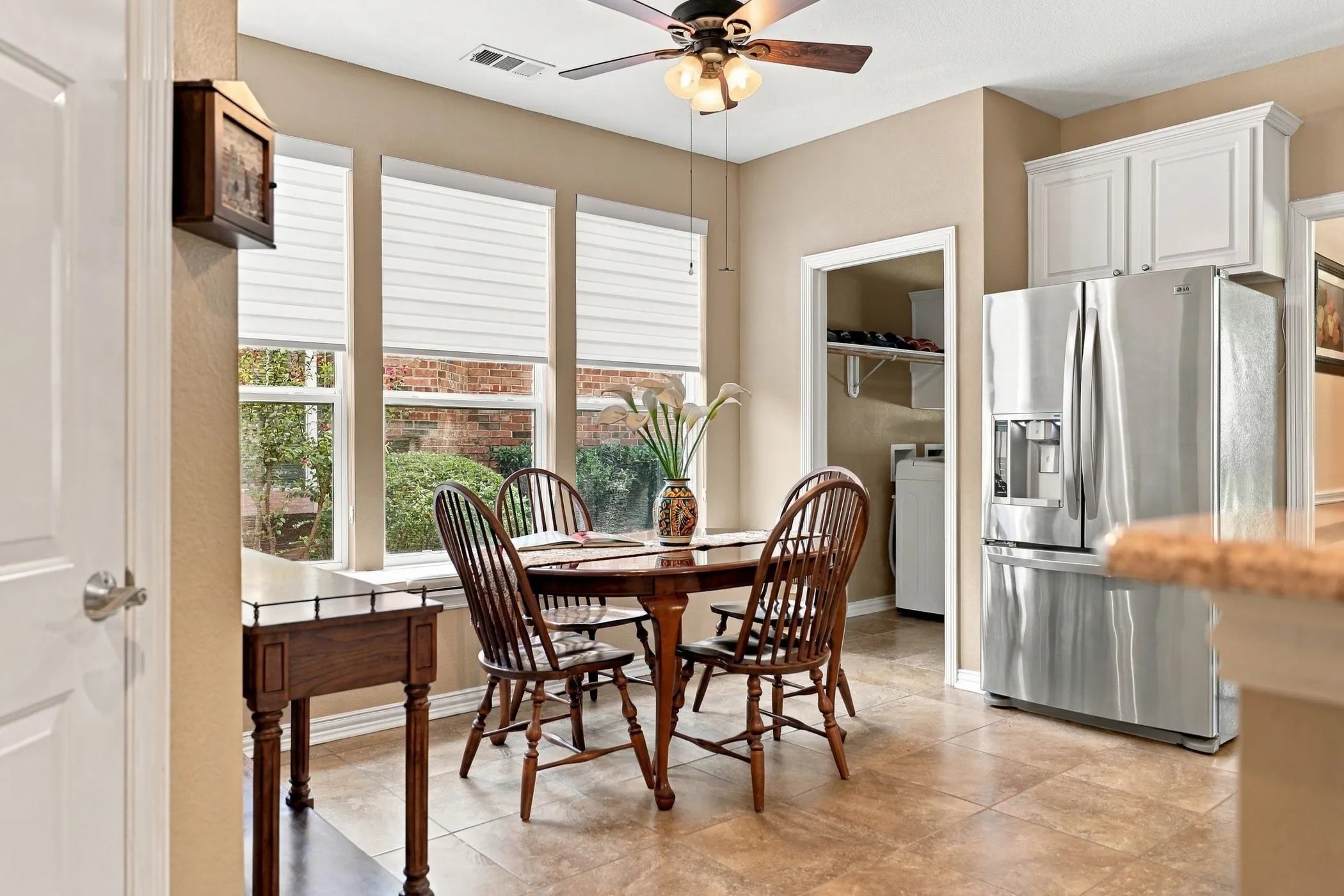 Light and bright breakfast room with window seat.
