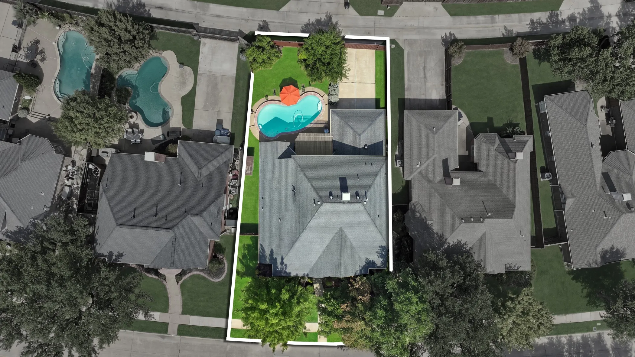 Expansive backyard with pool, surrounding patio, and mature trees.  Room for play.