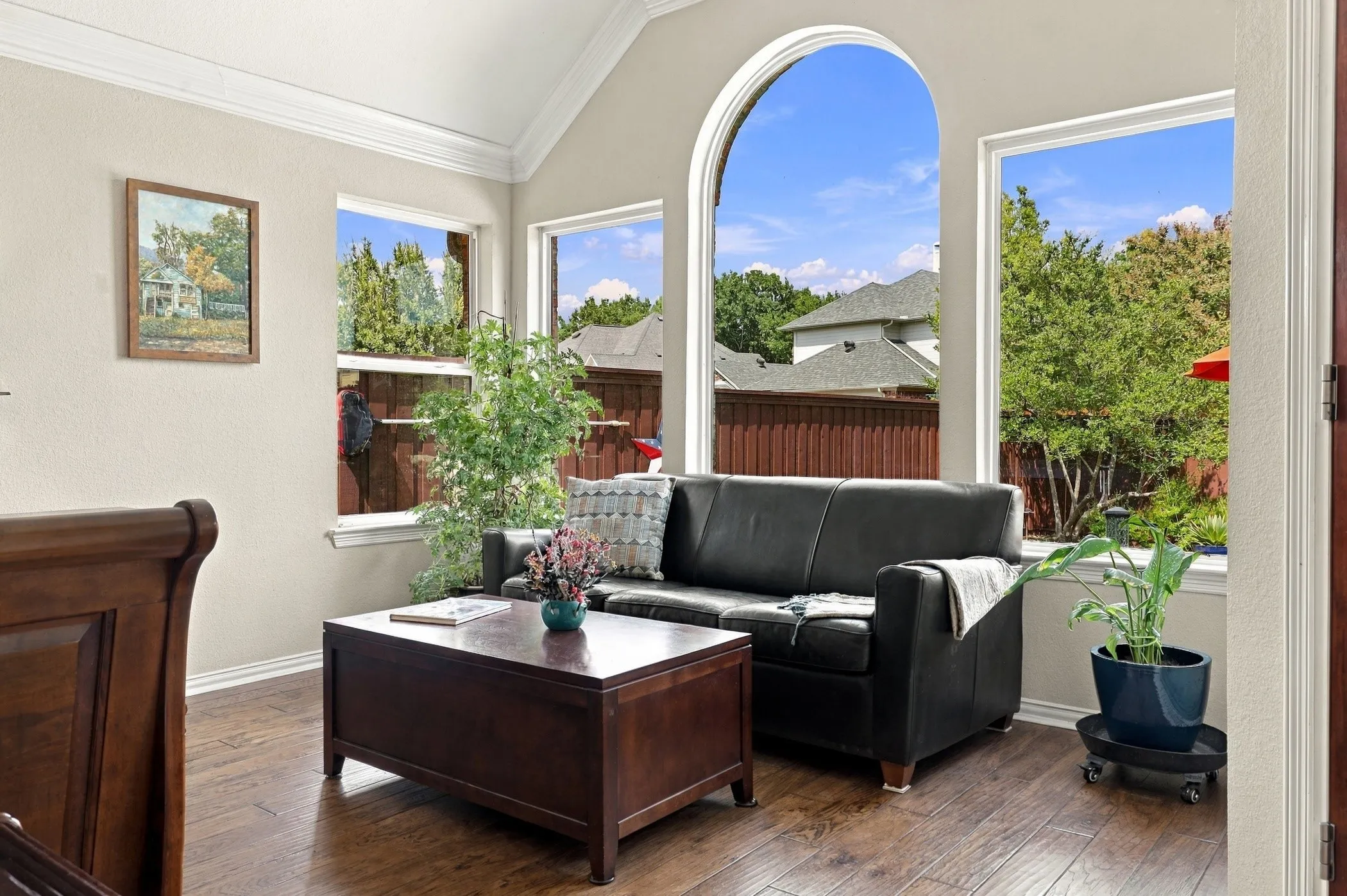 Sitting area in primary suite overlooking backyard.