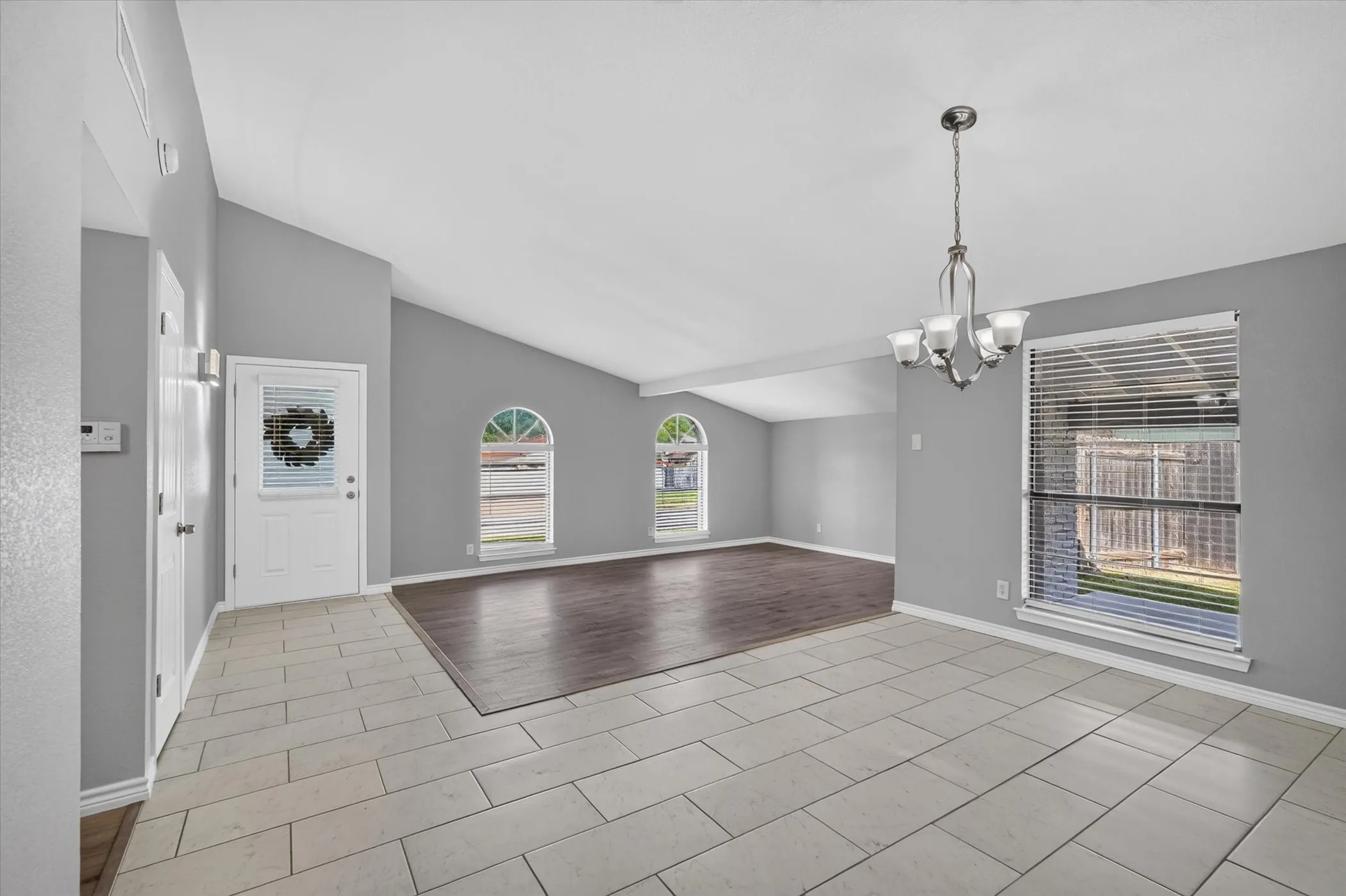Spacious living area with architectural designs throughout