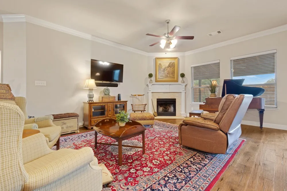 Living room with wood burning fireplace.