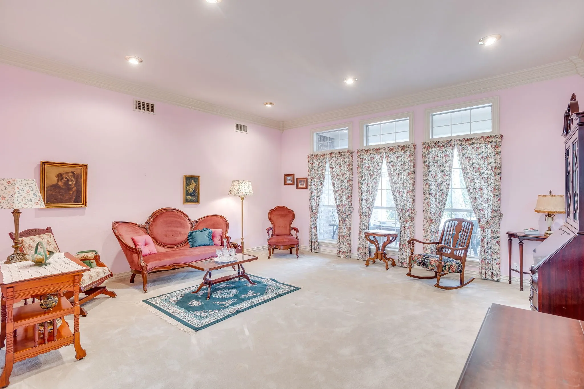 Expansive room with recessed lighting, crown molding, and multiple windows