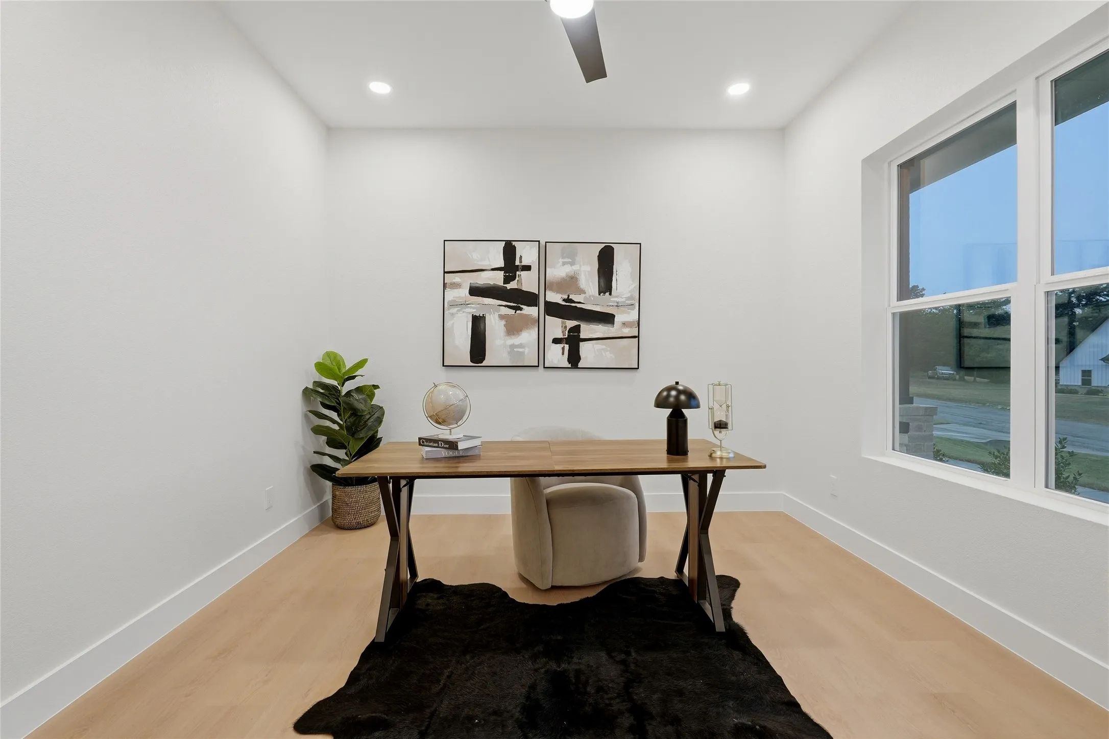 Recessed lighting, wood-finish flooring, ceiling fan, and white trim