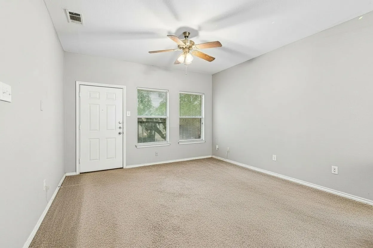 Generously sized living area provides flexibility for multiple furniture arrangements while remaining connected to the dining space. | 5933 Robinwood