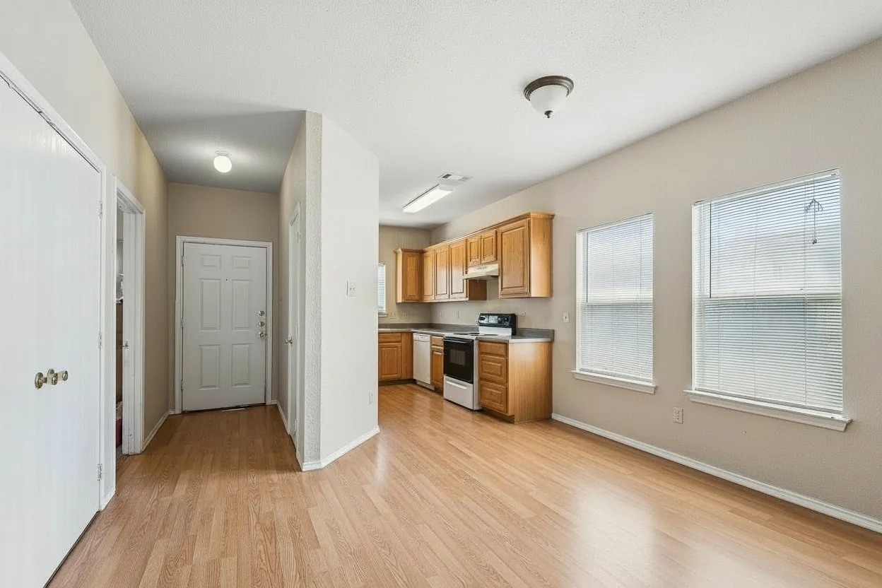 Wood-look laminate flooring creates a cohesive flow from the entry into the kitchen and dining areas for practical, low-maintenance everyday living. | 5931 Robinwood