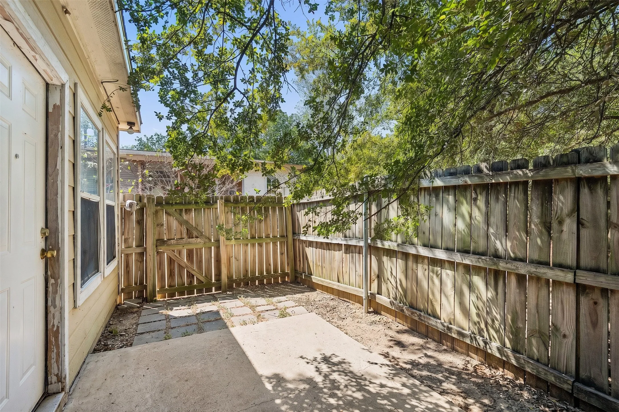 Extended patio expands the usable living space outdoors with room for seating, grilling or relaxing within the fenced yard. | 5931 Robinwood