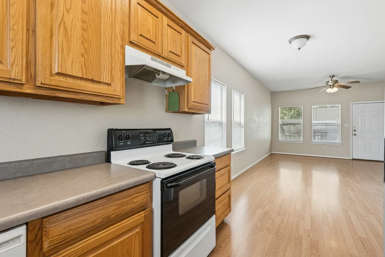Open connection between the kitchen and dining area provides an efficient layout with generous cabinetry and easy-care flooring. | 5931 Robinwood
