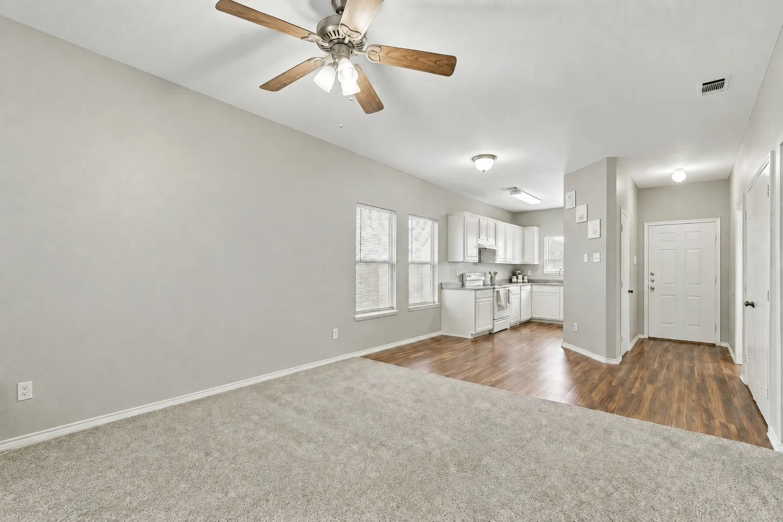 Open sightlines between the living and dining areas enhance the sense of space and create an easy everyday flow. | 5933 Robinwood