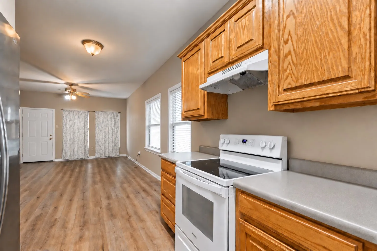 The kitchen thoughtfully opens to the dining and living areas. | 5961 Robinwood