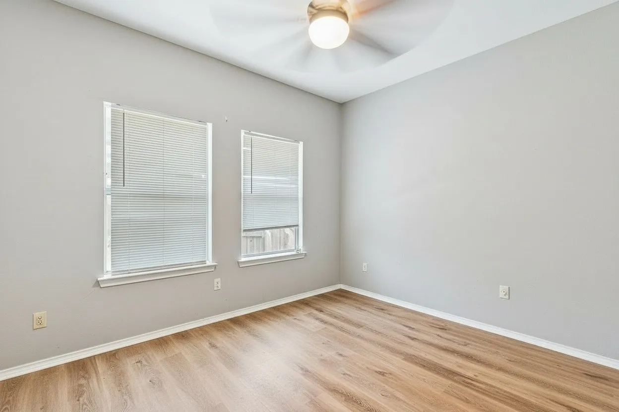 The second bedroom features neutral finishes and closet storage, completing the functional 2-bedroom floor plan. | 5959 Robinwood