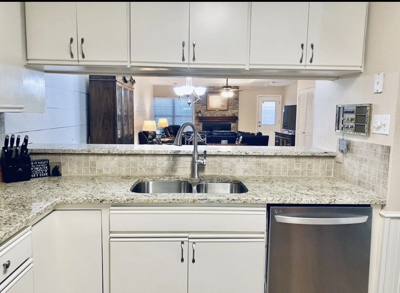 Granite-style countertops with a tiled backsplash