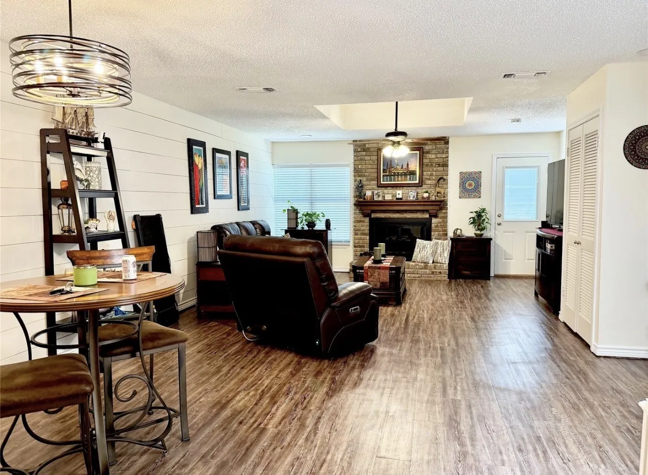 Open concept living space featuring vaulted ceiling and ceiling fan.