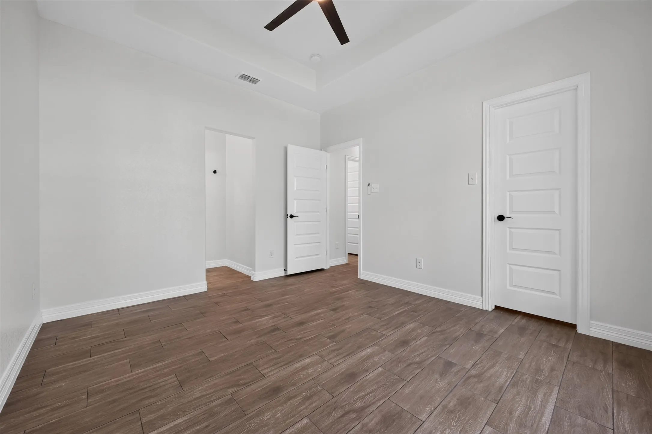 Front bedroom with direct access to a Jack-and-Jill en-suite bath, offering added convenience and privacy.  Large walk in closet for storage.