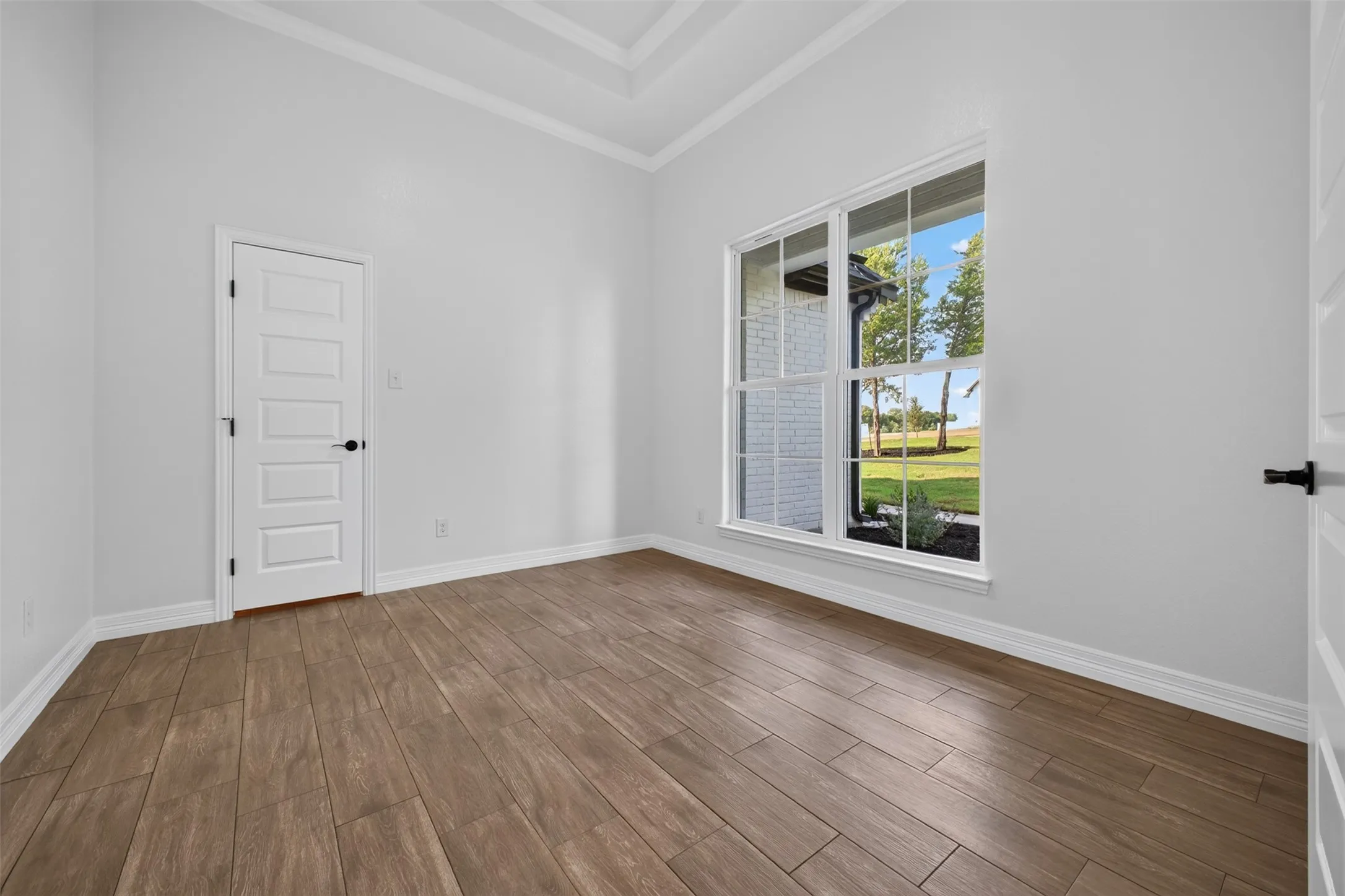 Spacious Office just off of the foyer with abundant natural light and a walk-in closet offering convenient storage