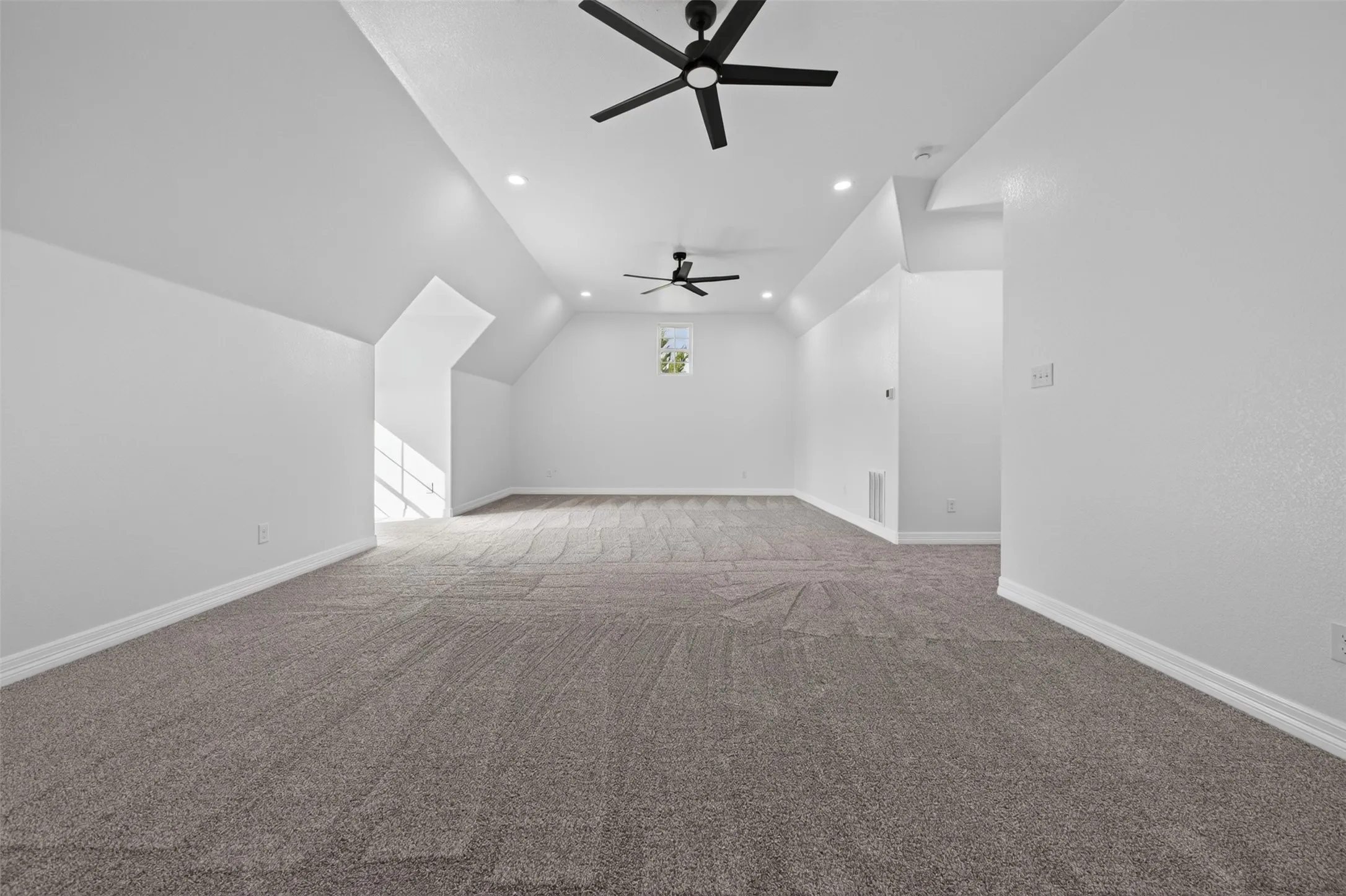 Oversized flex room above garage provides abundant space for a game room, media room, home gym, hobby area, or additional living space.