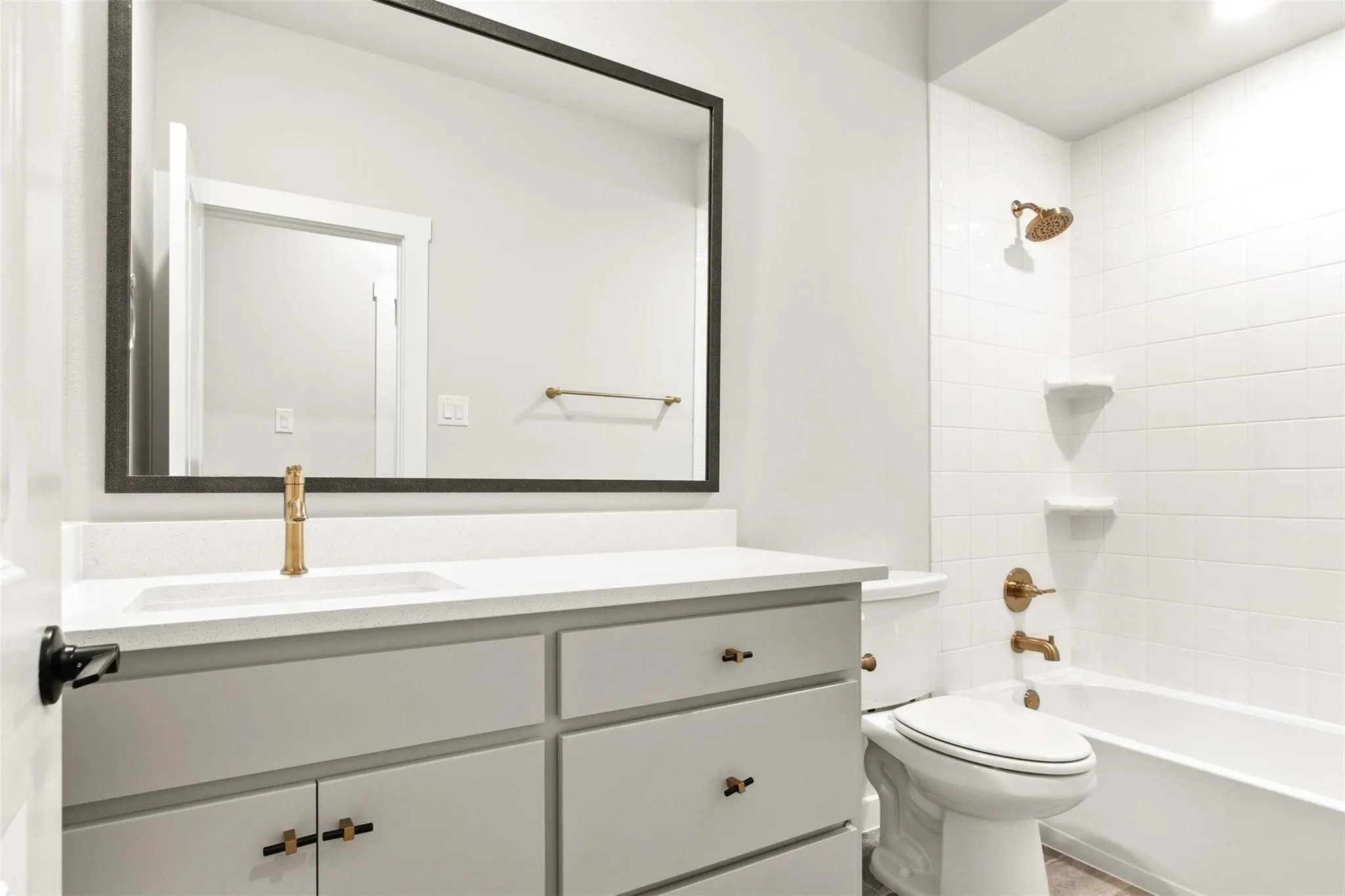 Bathroom featuring vanity and shower / bath combination