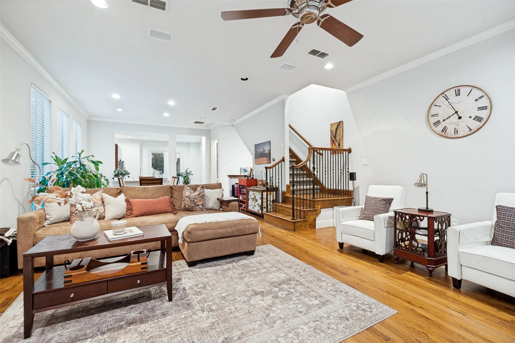 Living looking at open dining and kitchen