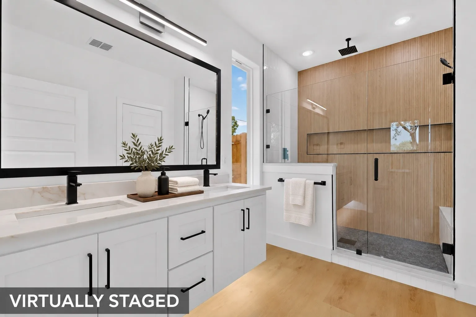 Dual vanities and a walk-in shower