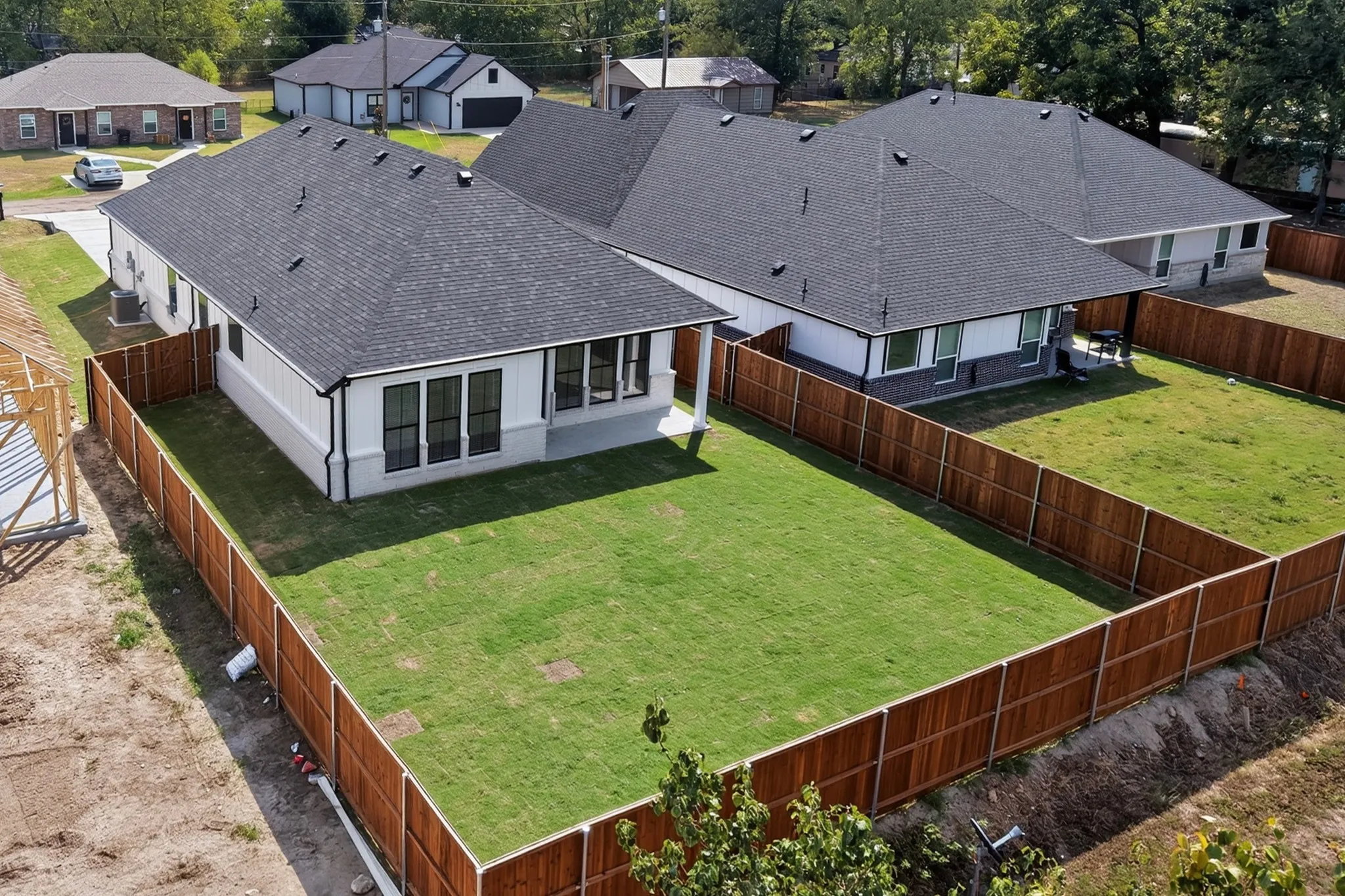 Aerial view of the newly construction home and property