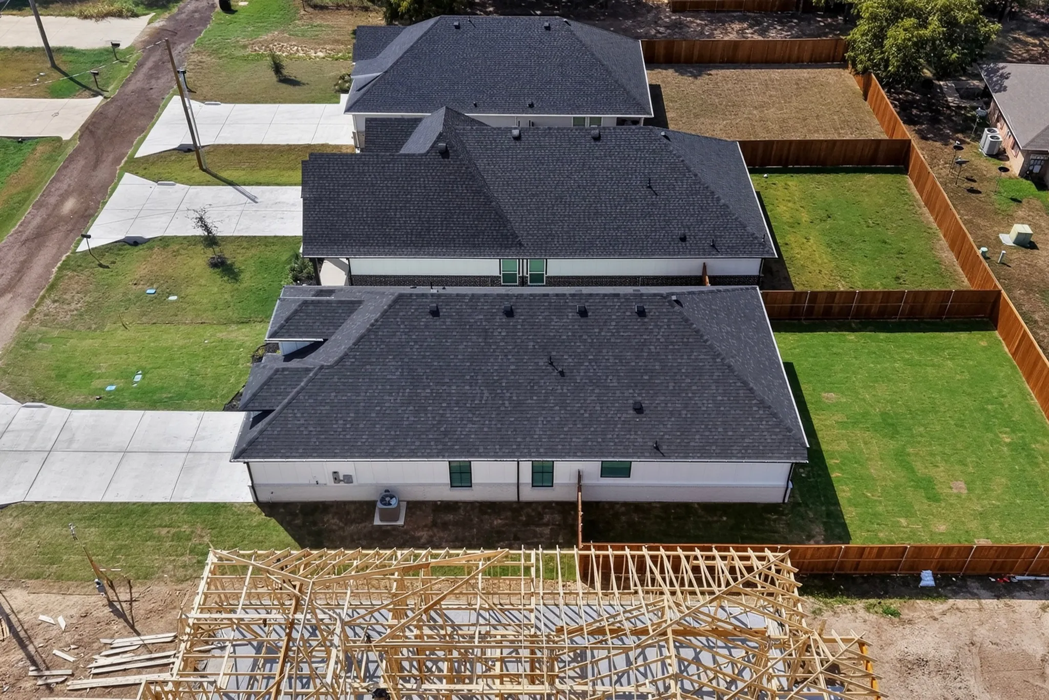 Aerial view showcasing the home, backyard and surrounding neighborhood