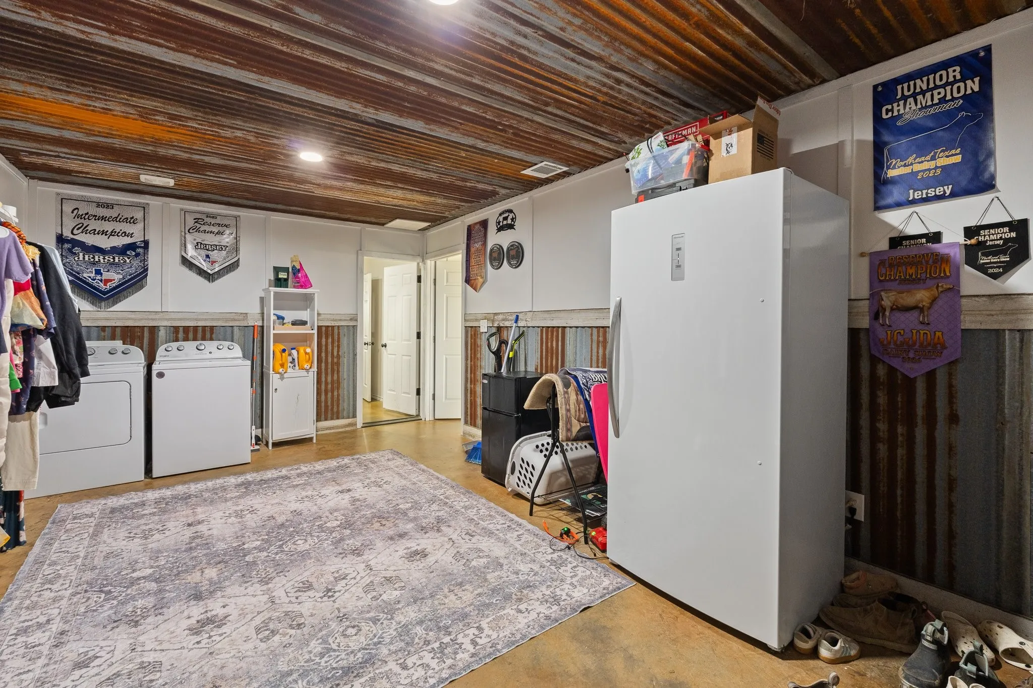 Massive laundry with exterior access and second covered porch.