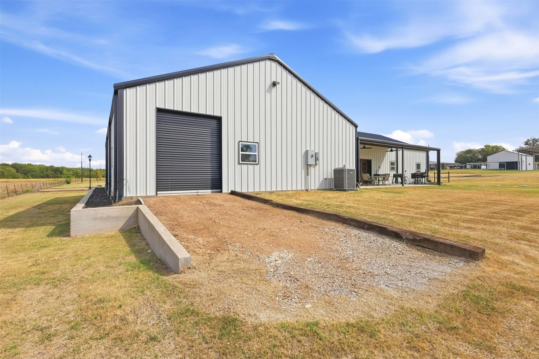3rd door in garage- drive through garage- great for RV parking, mowing, convenience
