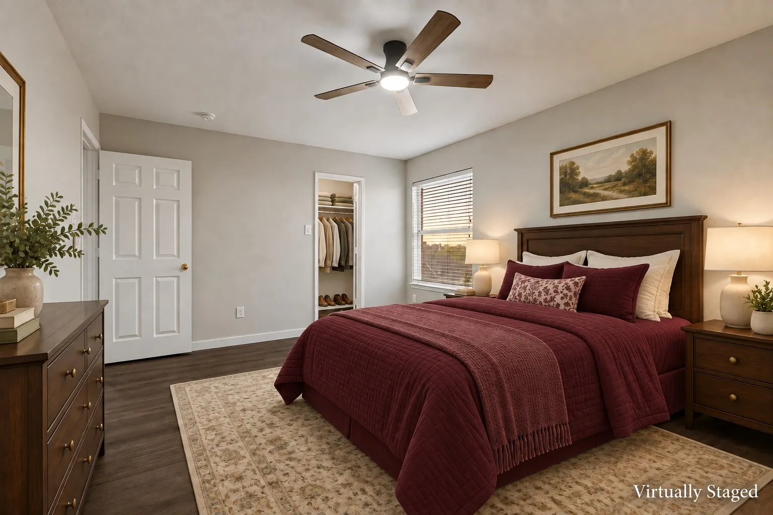 Wood-finish flooring, ceiling fan with integrated lighting, window with blinds, and built-in closet with shelving