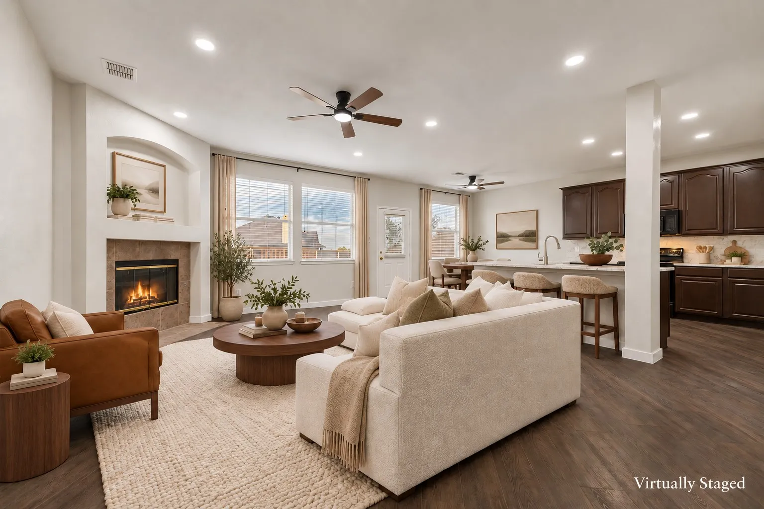 Living space featuring wood-finish flooring, recessed lighting, and a ceiling fan