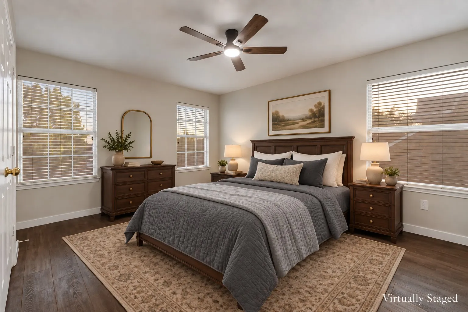 Wood-finish flooring with a ceiling fan featuring integrated lighting