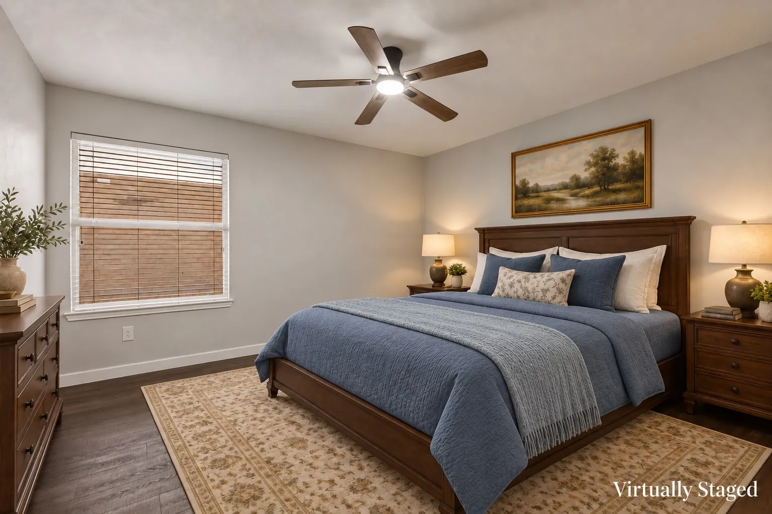 Dark wood-finish flooring, ceiling fan with integrated lighting, window with blinds.