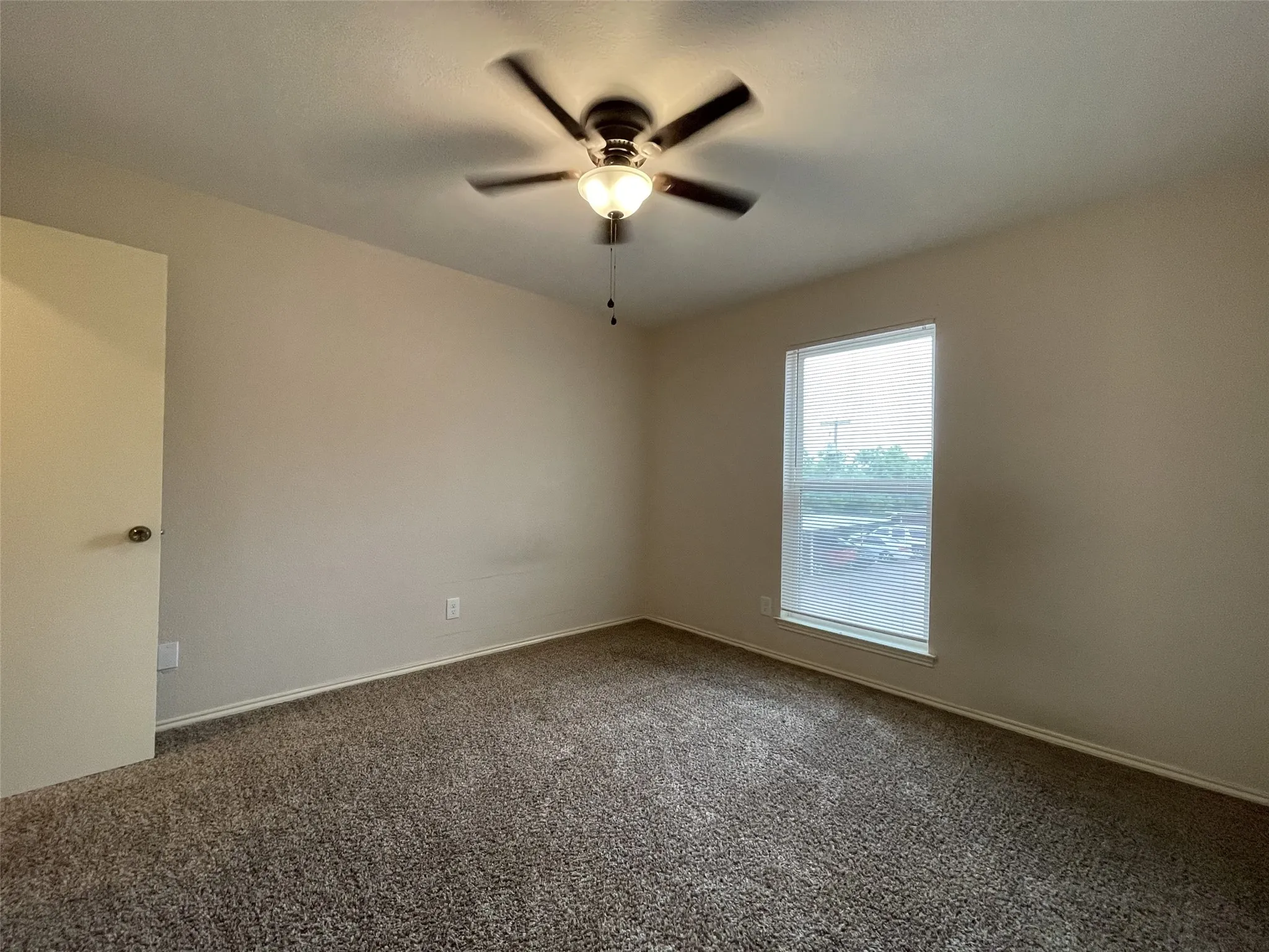 Neutral wall tones and textured carpeting