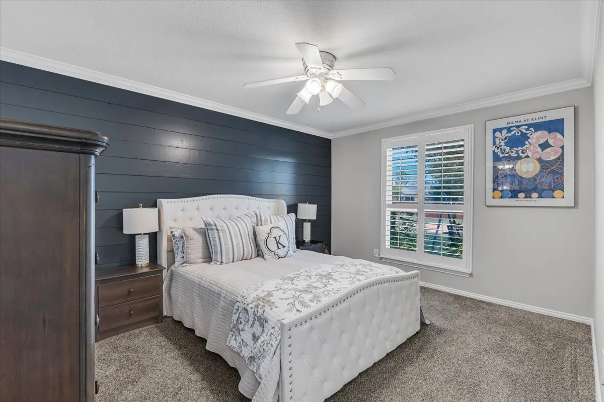 Second bedroom located downstairs on front of home