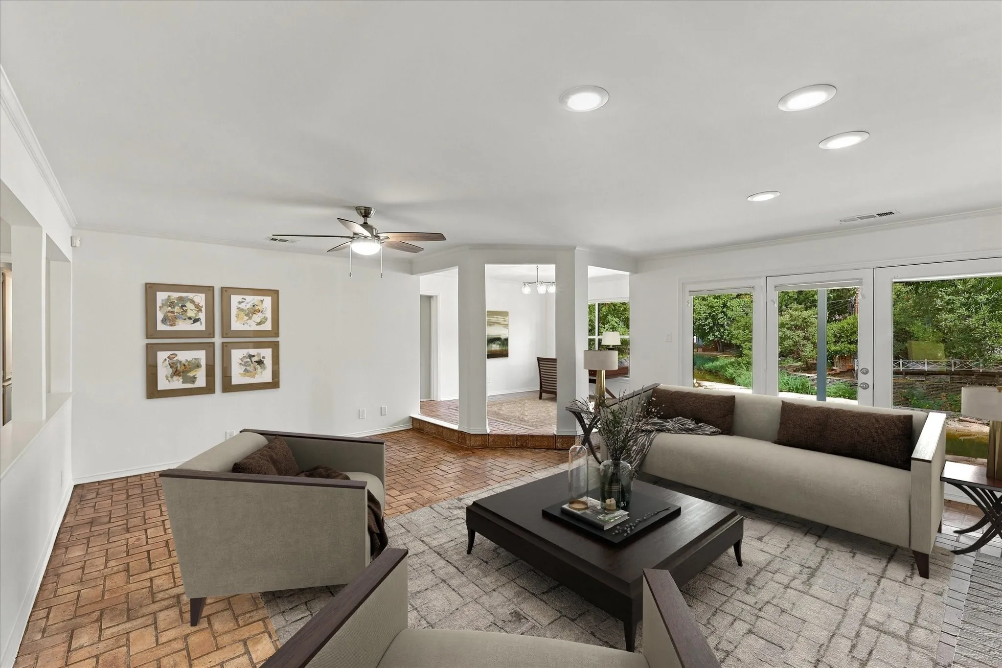 Recessed lighting, wood-finish ceiling fan, and extensive glass doors