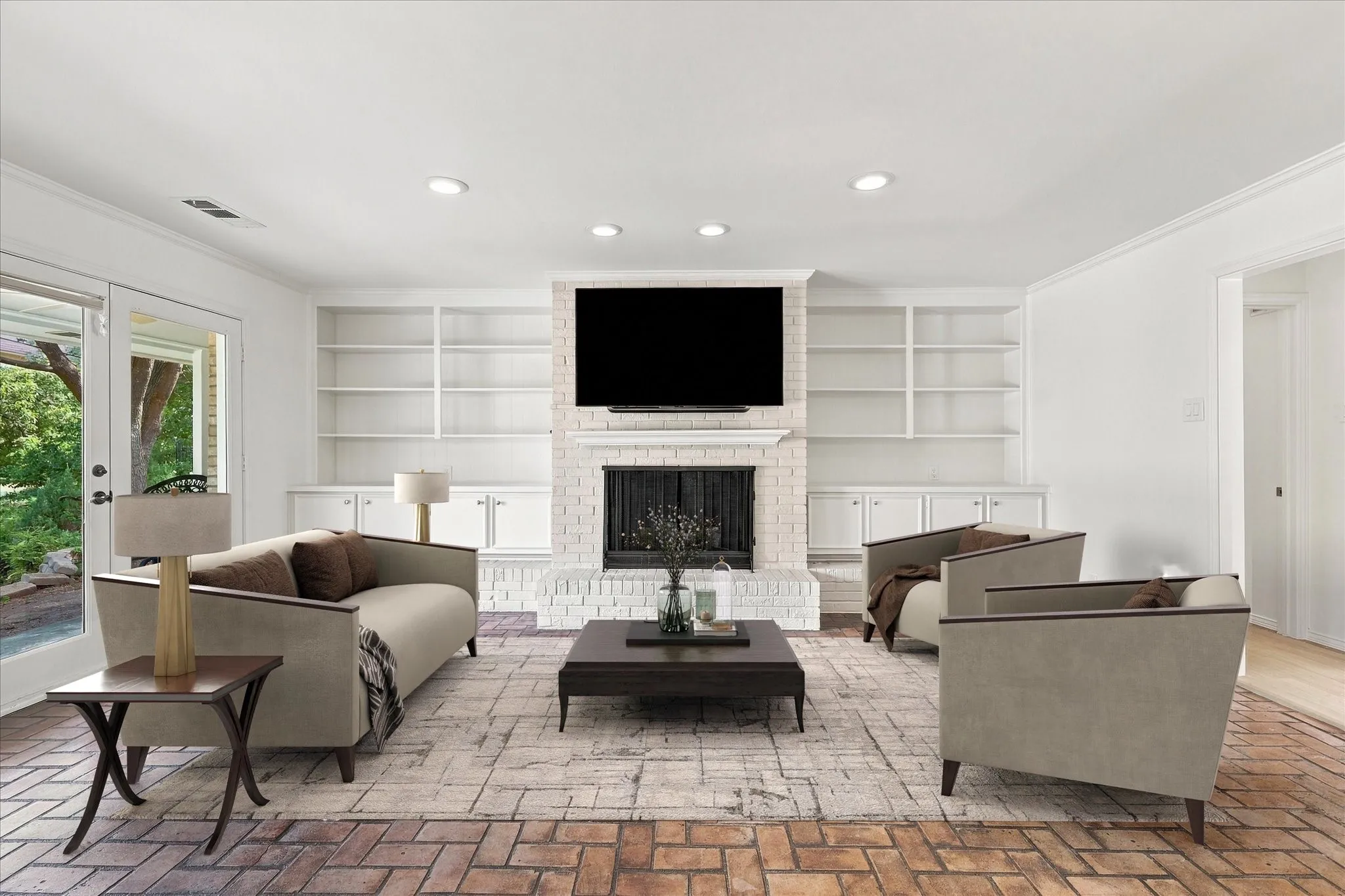 Brick flooring, built-in shelving, recessed lighting, and a brick fireplace