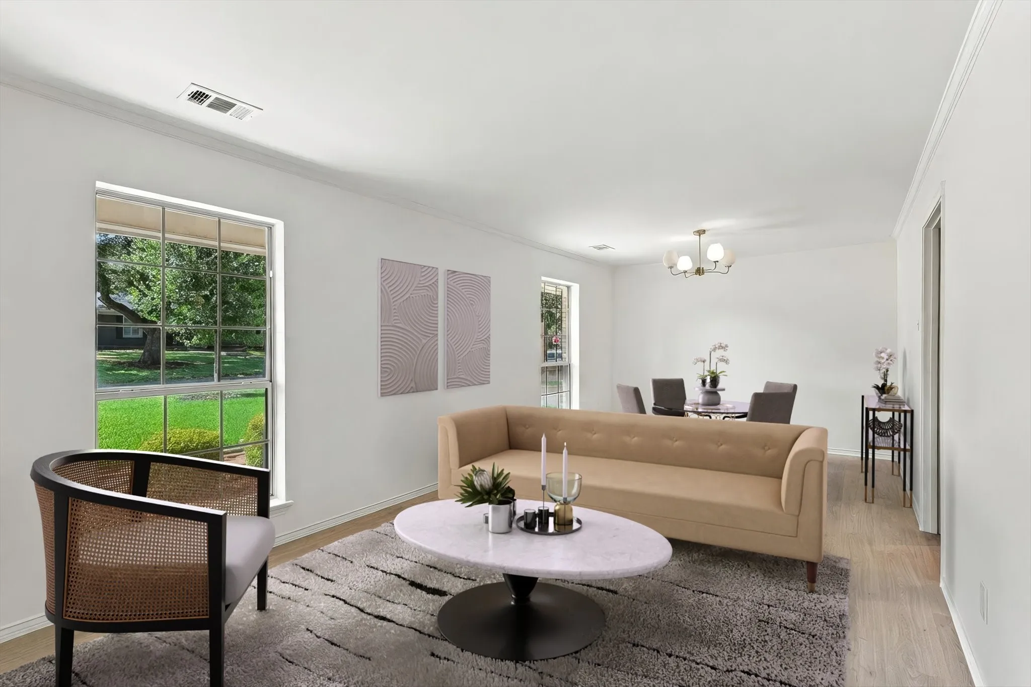 Recessed lighting, crown molding, wood-finish flooring, and a contemporary chandelier