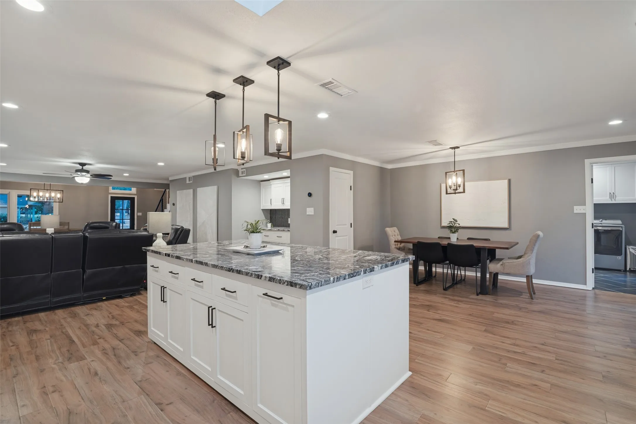 The kitchen and breakfast spaces flow perfectly for serving and entertaining.
