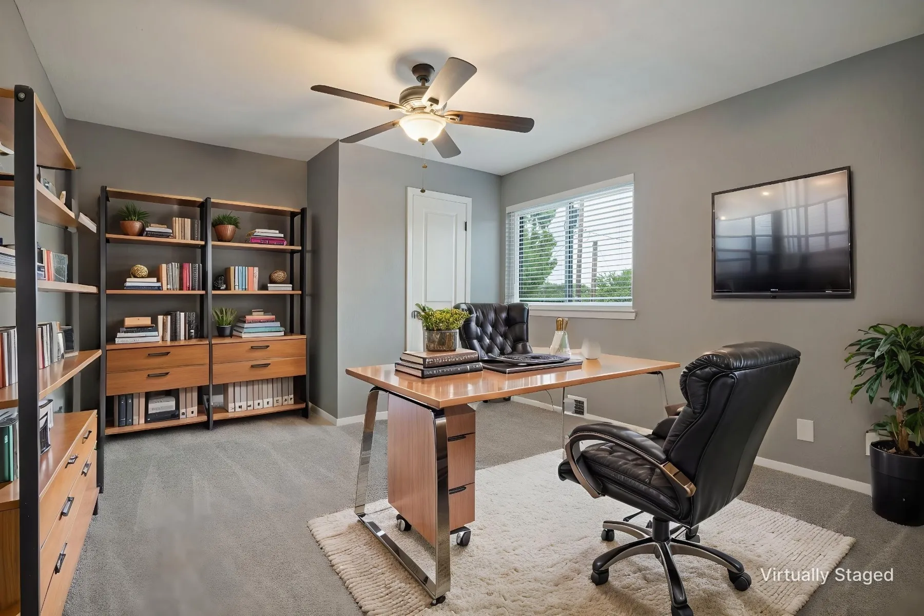 Shown here as an office, this secondary bedroom at the top of the stairs overlooks the side yard and, like all of the upstairs spaces was refreshed in 2020 with interior doors, door handles, door hinges, outlets, light switches, air vents, ceiling fans, and light fixtures.
