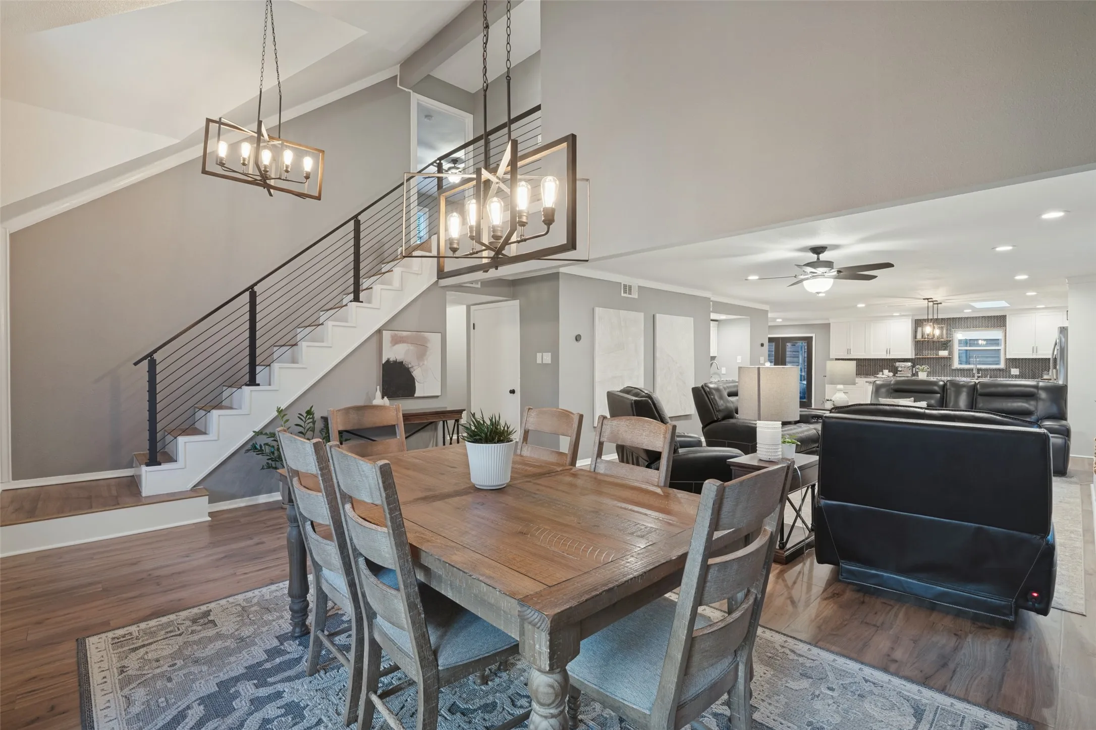 The stairs were updated in 2021 with contemporary metal railings and laminate flooring.