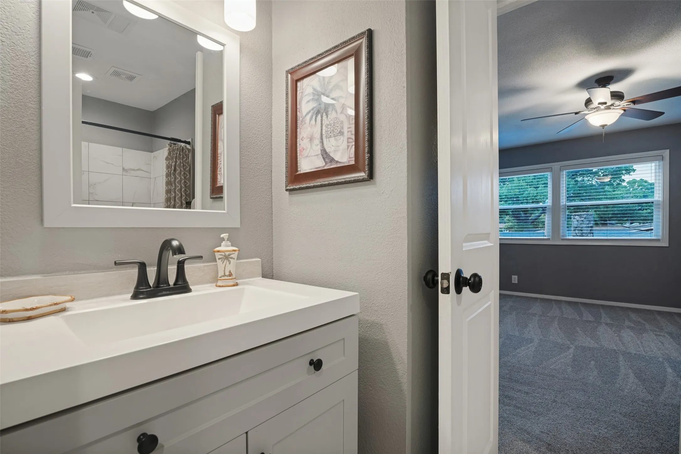 Connected to the second primary bedroom upstairs, this bath was updated in 2020 including, cabinet, counter top, mirror, lighting, tile tub surround, tile flooring, and plumbing fixtures.