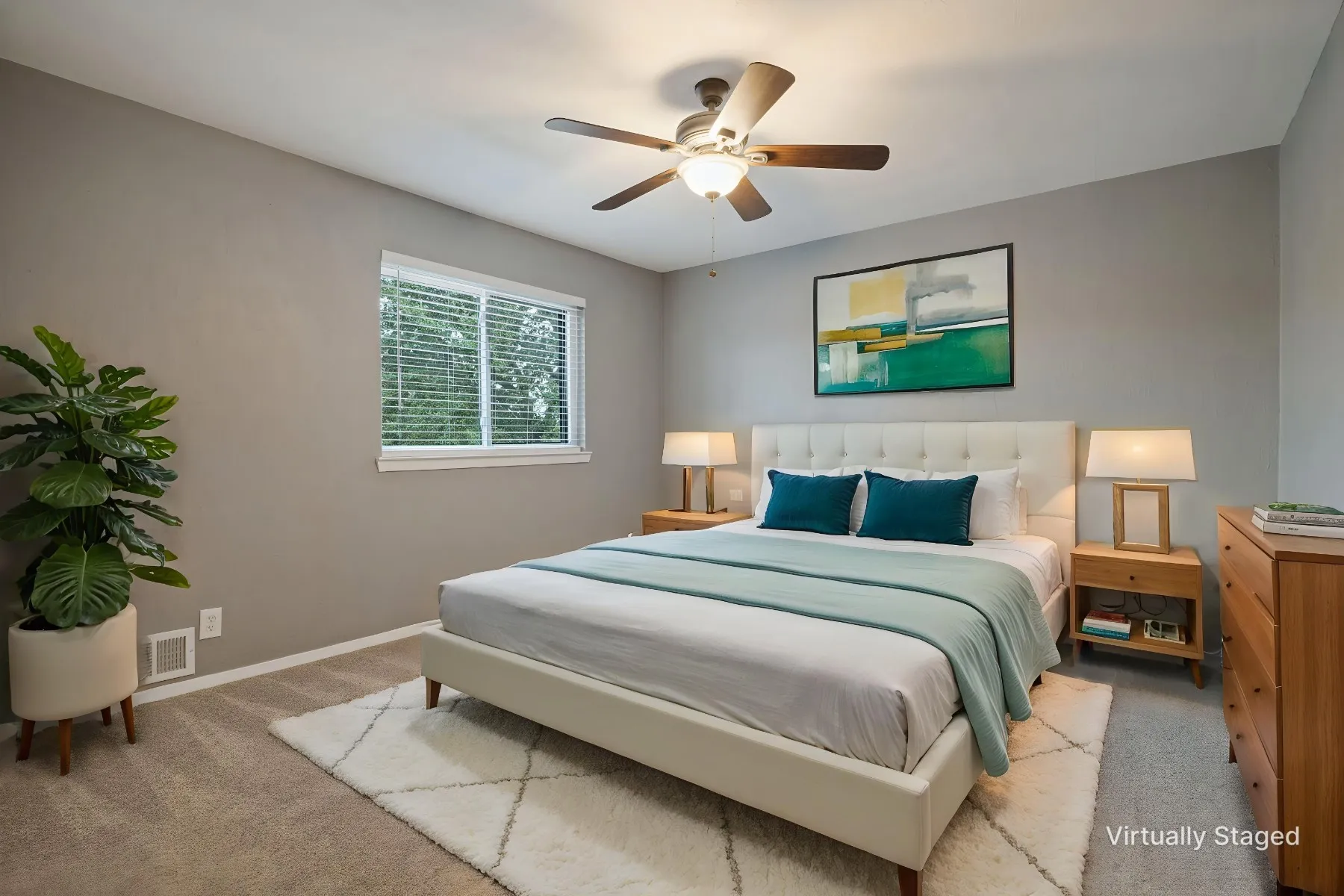 This secondary bedroom also overlooks the backyard and incudes an upgraded ceiing fan, good closet space, and neutral color scheme.