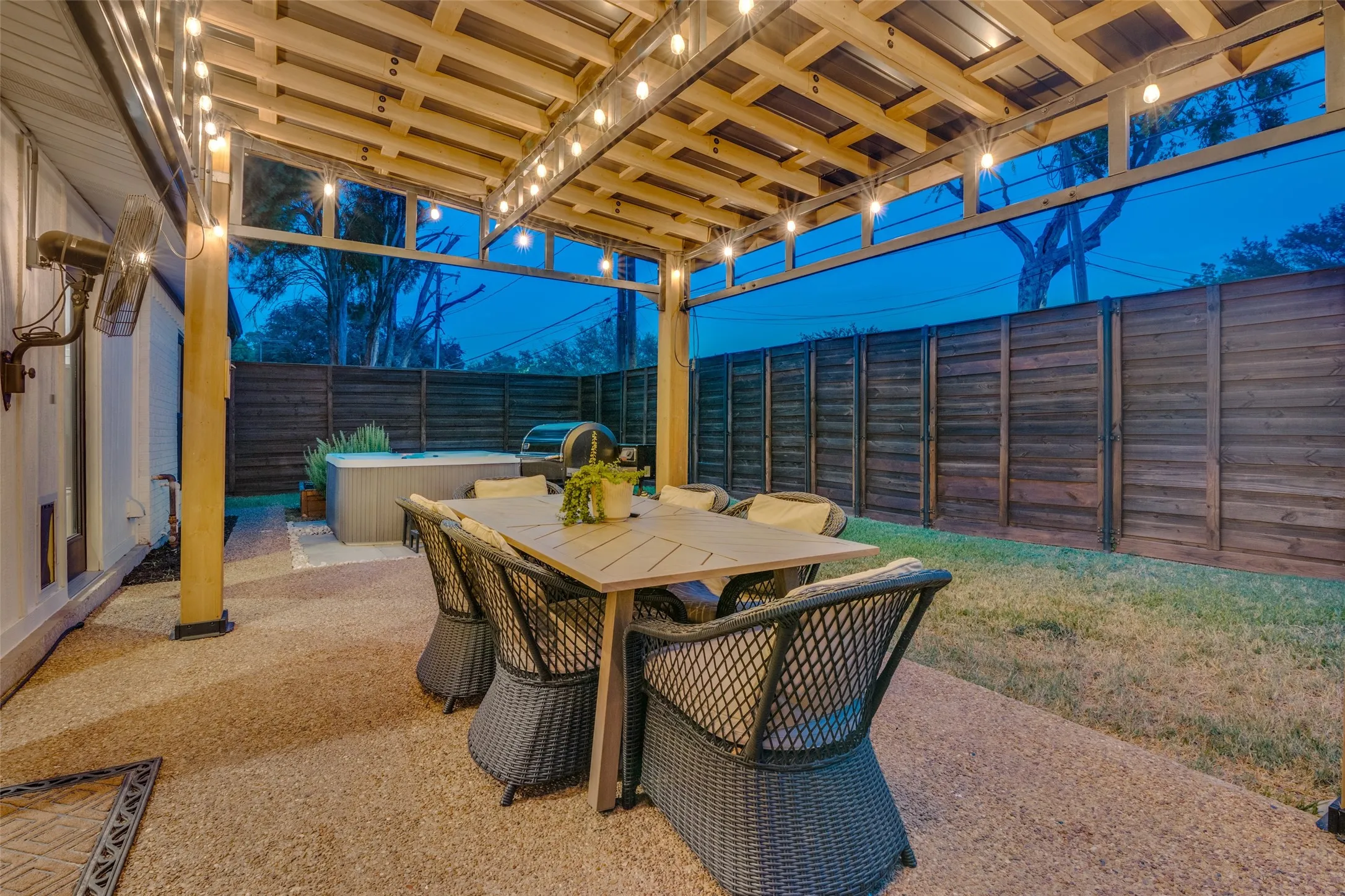 Easily accessible from the breakfast room, is this spacious, covered patio with accent lighting.
