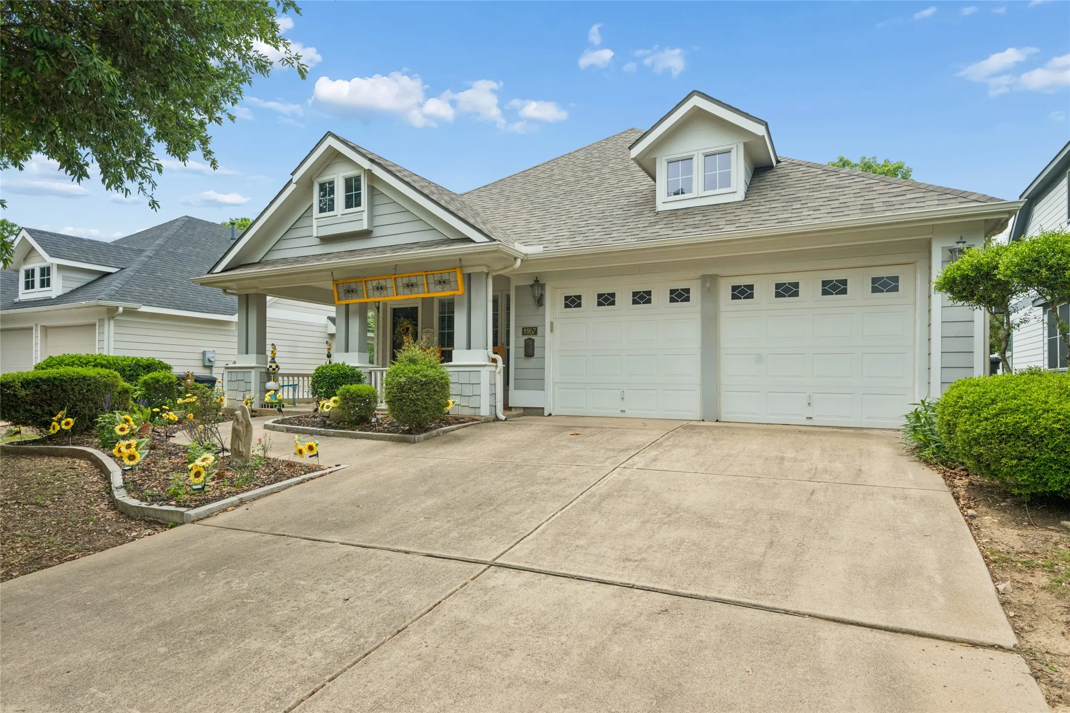 Gray siding exterior with white trim